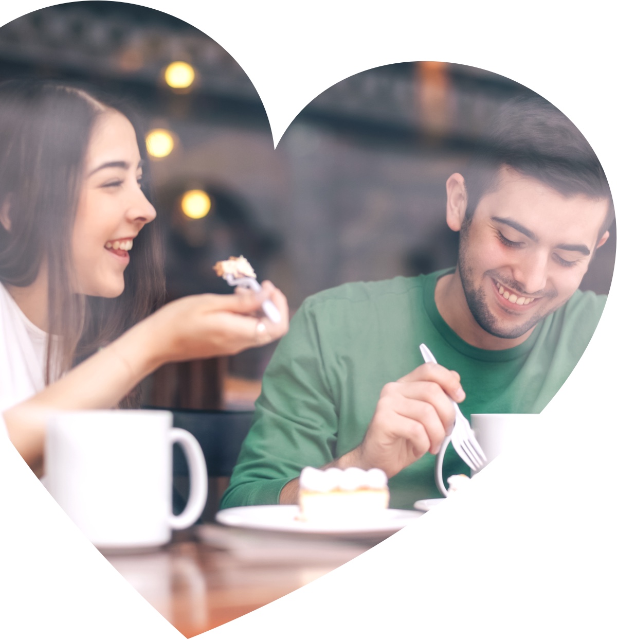 a young womand and a young man sitting in a cafe